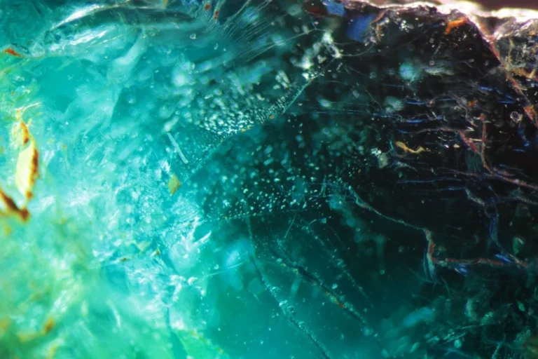 Tiny crystal inclusions on a partially healed fissure plane in an Ethiopian tourmaline.